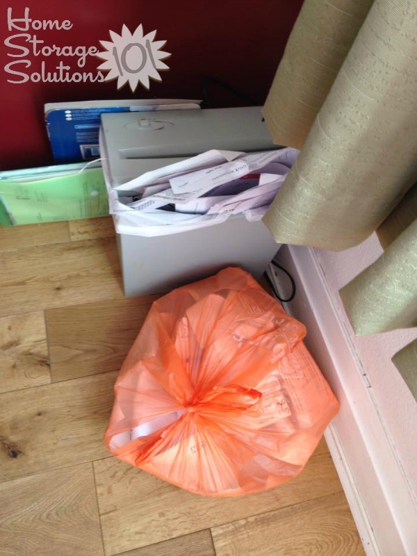 Sally's shredding and recycle piles after getting rid of junk mail {featured on Home Storage Solutions 101}