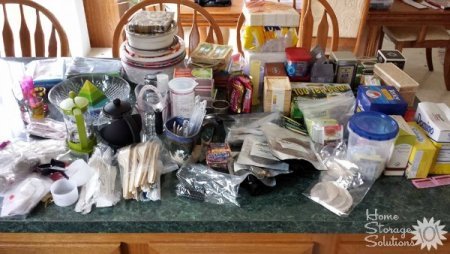 All of this stuff came out of one kitchen cabinet. That's why you should NEVER tackle more than one cabinet at a time when decluttering or you'll get overwhelmed.