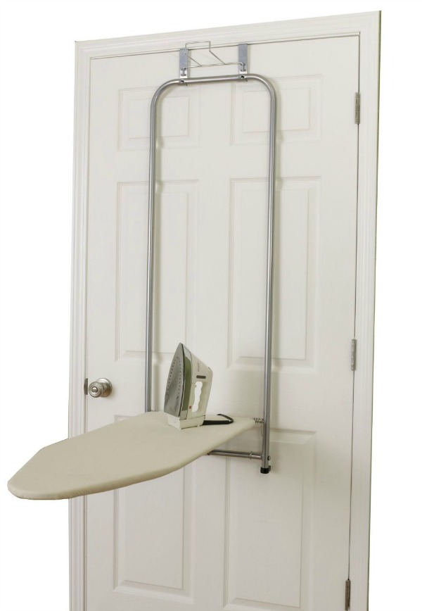 Keep your ironing board on the back of a door, and when you're ready to iron just fold it down and it's ready for use with this over the door ironing board {featured on Home Storage Solutions 101}