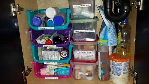 stackable labeled bins for storing medications and first aid supplies