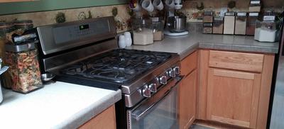 Stove and adjacent counters.