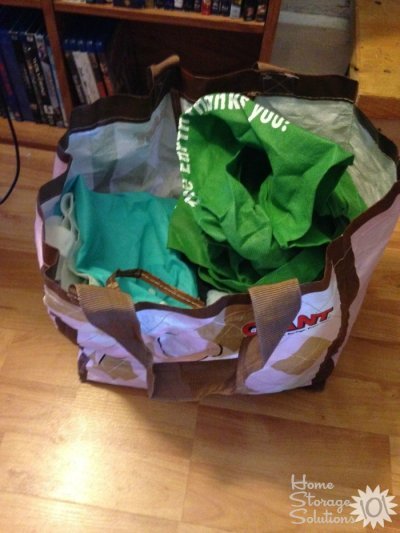 Decluttered reusable shopping bags that are ripped and torn {on Home Storage Solutions 101}