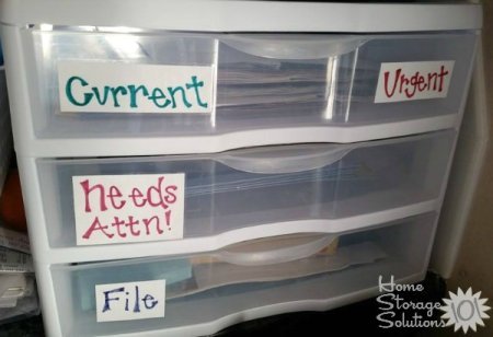 Plastic file drawers used to organize paperwork on a daily basis, to keep things organized and paper clutter at bay {featured on Home Storage Solutions 101}