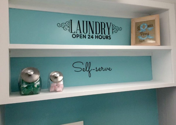 Ideas for laundry room decor, including vinyl wall decals and laundry detergent storage containers, shown by a reader, Julie {featured on Home Storage Solutions 101}
