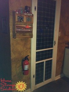 fire extinguisher placement by kitchen