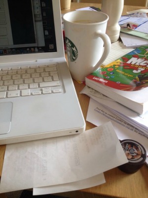 messy desk at the dining room table