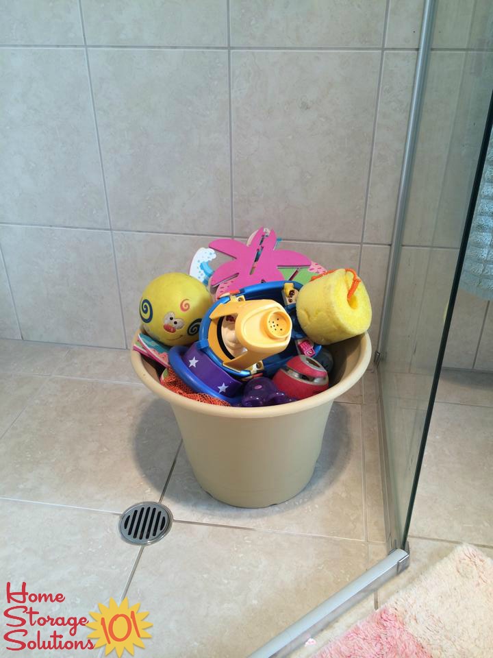 Use a flower pot, with holes in the bottom, to store bath toys {featured on Home Storage Solutions 101}