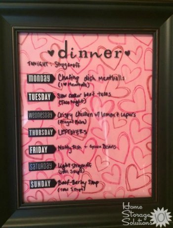 DIY menu board to display meals for week, using a frame, stickers and scrapbook paper {featured on Home Storage Solutions 101}