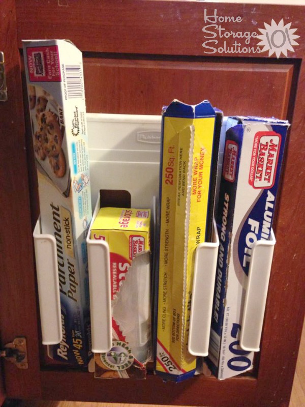 Store your kitchen wrap under your sink mounted on the inside of the cabinet door. {featured on Home Storage Solutions 101}