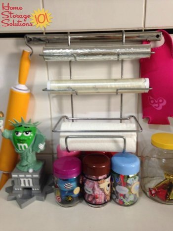 Use a wall mounted holder for your plastic wrap and aluminum foil {featured on Home Storage Solutions 101}