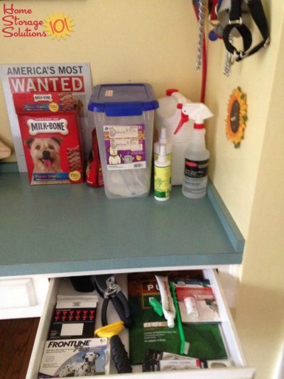 Decluttered and organized pet corner in kitchen, where keep pet related supplies {featured on Home Storage Solutions 101}