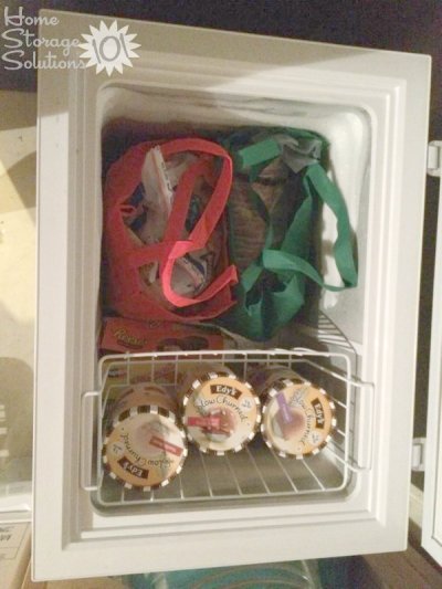 Organize your chest freezer with reusable grocery bags, making it easy to lift out the bags as you need to retrieve something specific from inside {featured on Home Storage Solutions 101}
