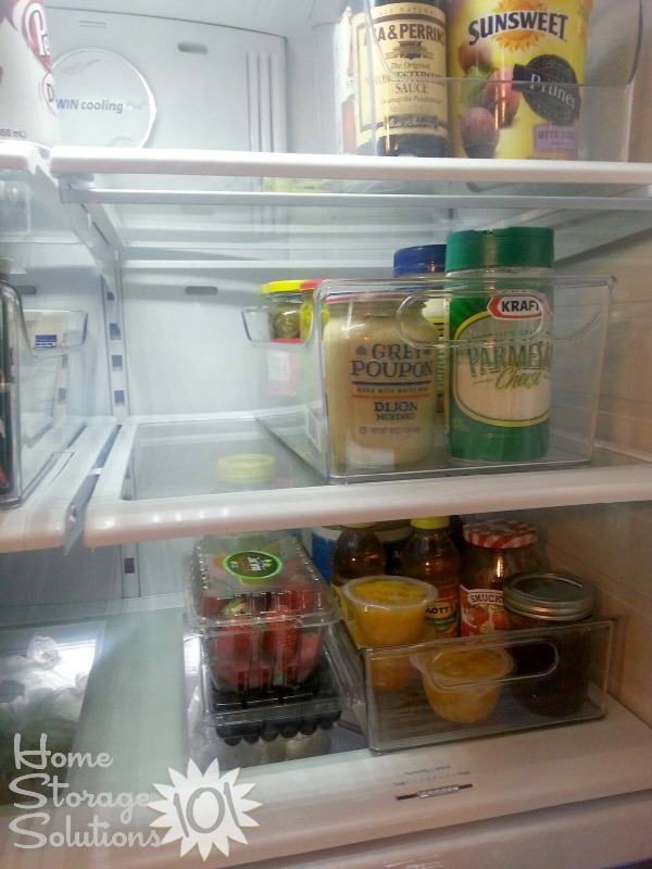 Use containers for refrigerator organization {featured on Home Storage Solutions 101}