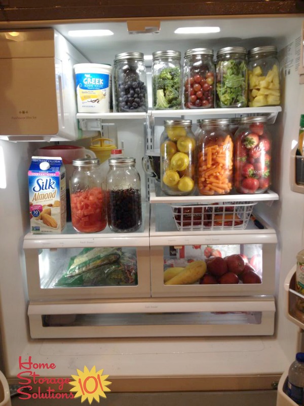 Containerize your refrigerator using glass jars to hold produce {featured on Home Storage Solutions 101}