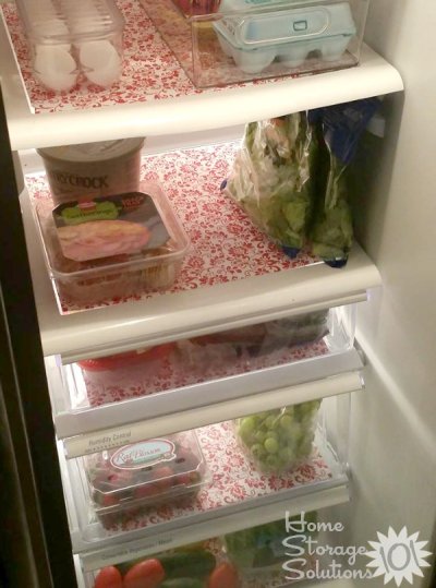 Add non-adhesive shelf liners to your refrigerator to help with spills and make it look pretty {featured on Home Storage Solutions 101}