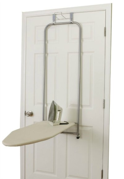 Keep your ironing board on the back of a door, and when you're ready to iron just fold it down and it's ready for use with this over the door ironing board {featured on Home Storage Solutions 101}