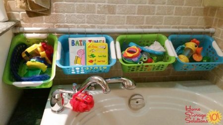 Bath toy storage made easy, with a tension rod, baskets and hooks {featured on Home Storage Solutions 101}