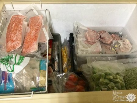 Organized chest freezer using baskets and bins {featured on Home Storage Solutions 101}