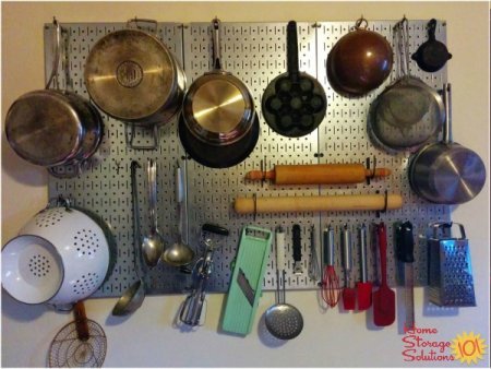 Hang your pots and pans and utensils on your wall like Julia Child with a pegboard {featured on Home Storage Solutions 101}