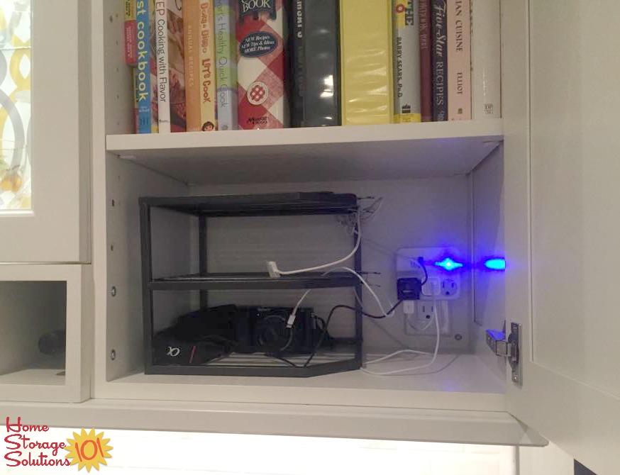 Use a three tiered corner shelf to create a DIY charging station for your electronics that you can place inside a cabinet {featured on Home Storage Solutions 101}