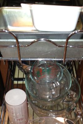 Stores heavy glass measuring bowls and pans