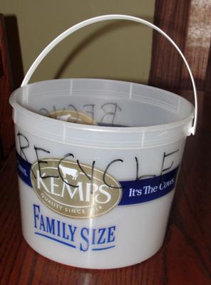 Ice cream bucket to collect recycling in bathrooms