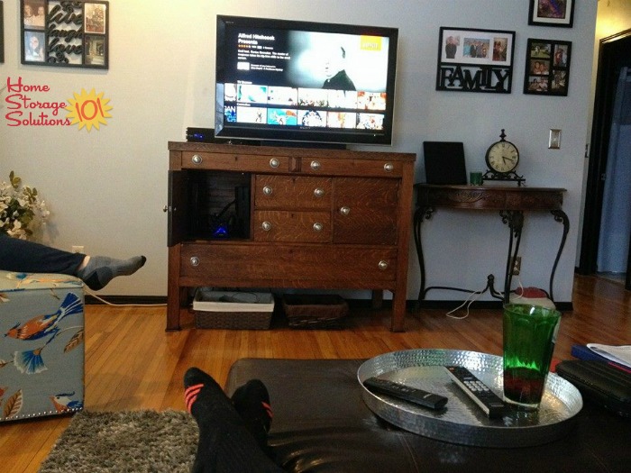 Decluttered and organized entertainment center in a living room {featured on Home Storage Solutions 101} Decluttered and organized entertainment center in a living room {featured on Home Storage Solutions 101}
