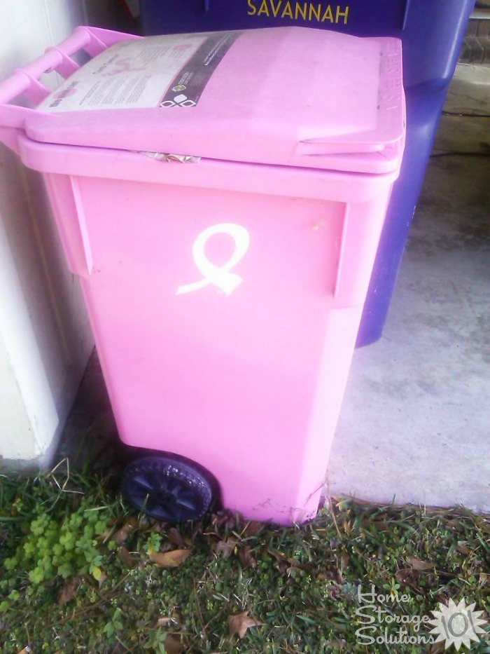Pink recycling container stored outdoors {featured on Home Storage Solutions 101}