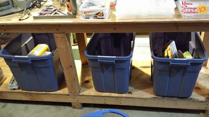 Three recycling containers in the garage, set up for sorting the recyclables in the household {featured on Home Storage Solutions 101}