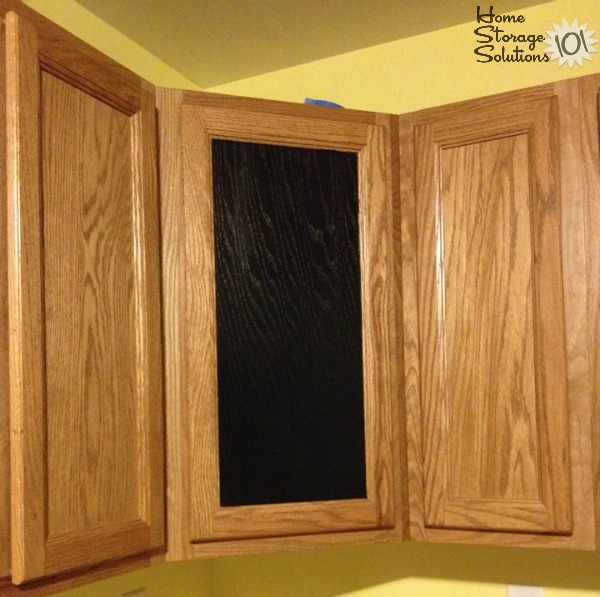 Use chalkboard paint on the front of a kitchen cabinet to have a built in way to write notes, such as your grocery list {featured on Home Storage Solutions 101}