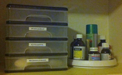 a lazy susan can help you get to medications even in the back of your cabinet without knocking anything over