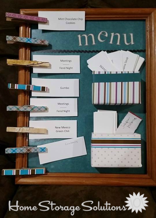 Menu board using paper clips, and premade meal cards {featured on Home Storage Solutions 101}