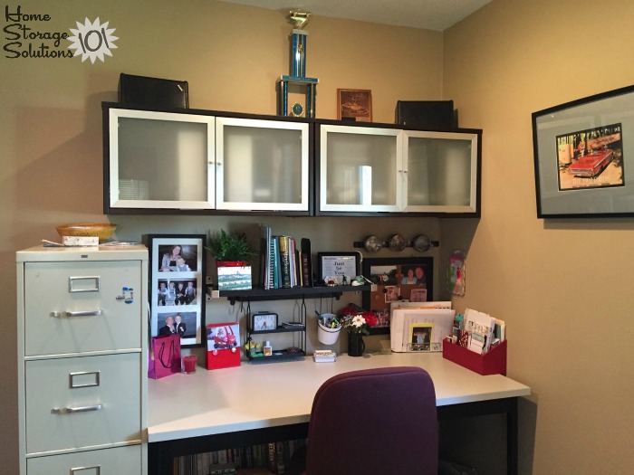 Organized home office space with cabinets above the desk for extra storage {on Home Storage Solutions 101}