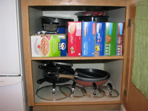 https://www.home-storage-solutions-101.com/images/xeven-when-using-hanging-pot-pan-rack-still-need-to-store-lids-somewhere-21761140.jpg.pagespeed.ic.p08Z8knsYQ.jpg