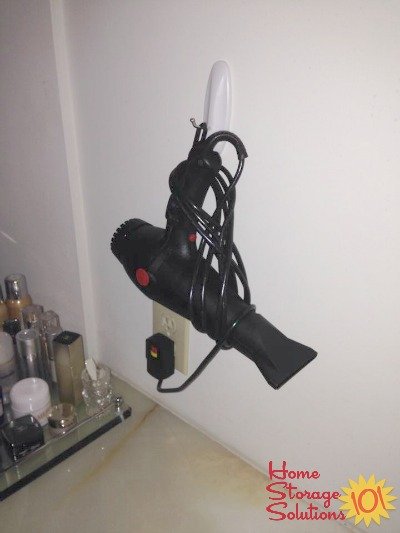 hang hair dryer on the wall with a command hook
