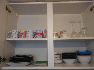 Organized cupboard with plates and bowls