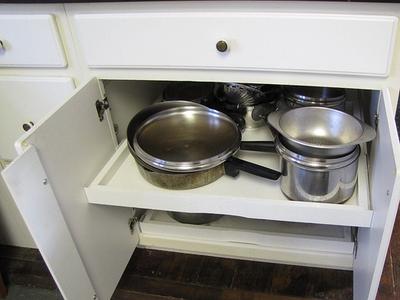 https://www.home-storage-solutions-101.com/images/xslide-out-pots-pans-drawers-make-it-easier-to-get-items-from-the-back-21761149.jpg.pagespeed.ic.0LlUyZUFGR.jpg