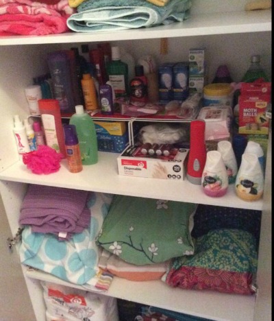 dedicated shelf in linen closet for small stockpile